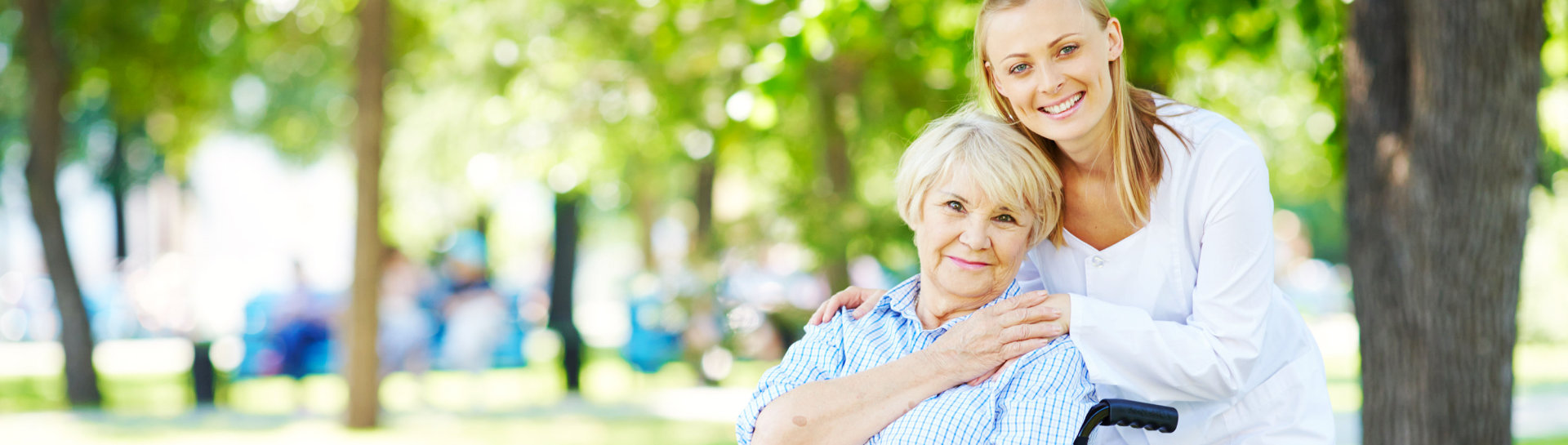 Caregiver taking care of elderly woman