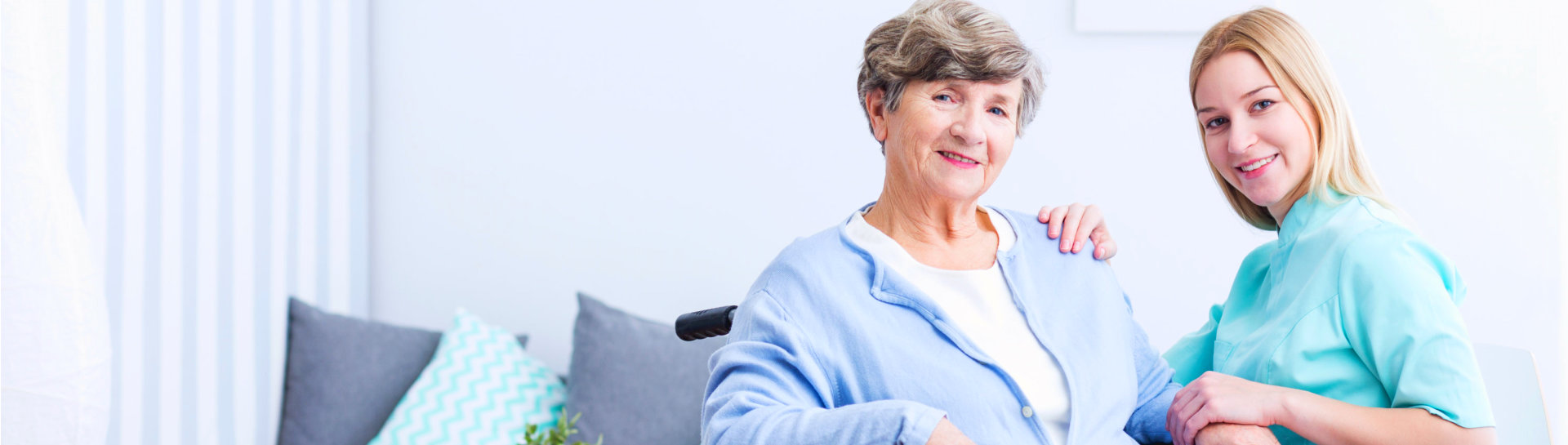 Photo of elderly women with disability and caregiver